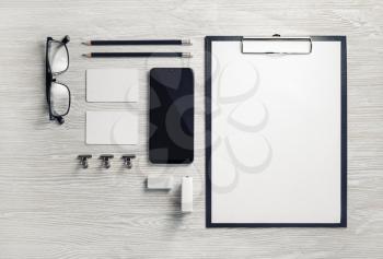 Blank corporate stationery set on light wooden background. Branding mock up. Top view. Flat lay.