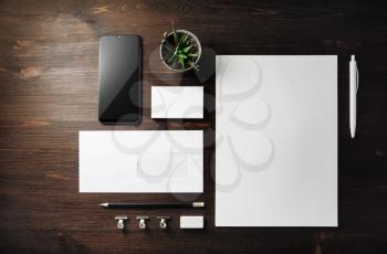 Blank corporate stationery set on wood table background. Template for branding design. Branding mock up. Top view. Flat lay.