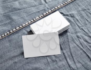 Business cards mock-up on denim background. White name cards.