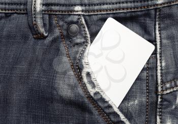 Blank credit card card in gray jeans pocket. White plastic chip card.