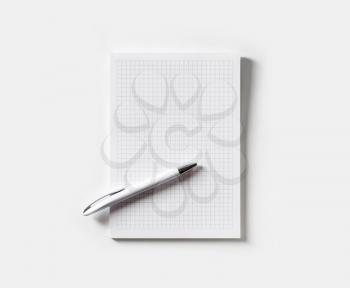 Blank copybook and pen on paper background. Copy space for text. Flat lay.