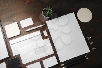 Blank stationery set on wood table background. Corporate identity template. Responsive design mockup.