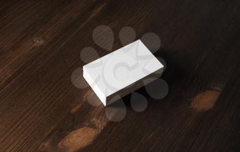 Mockup of blank business cards on wood table background.