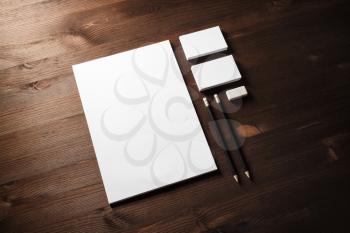 Photo of blank stationery set on wooden background. Corporate identity mockup. Responsive design template.