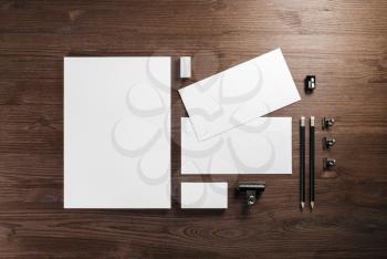 Blank corporate stationery template on wooden background. Responsive design mockup. Flat lay.