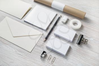 Photo of blank stationery set on light wooden background. Template for branding design. Branding mock up.
