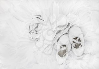 Children's ballet shoes, white skirt and hairpins. Flat lay.