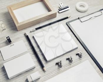 Business stationery mock-up. Blank corporate identity template on light wood table background.