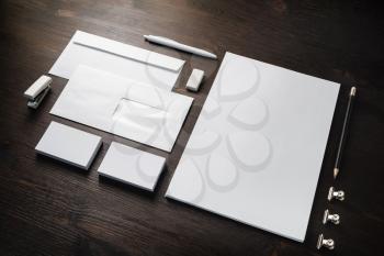 Blank corporate stationery set on wood table background. Branding identity mock-up.