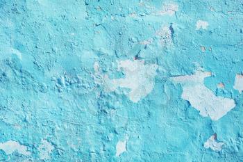 Peeling paint texture. Turquoise wall. Old cracked background
