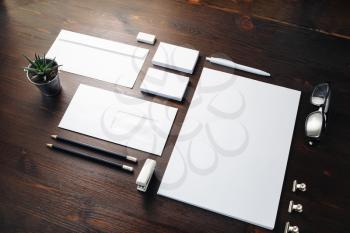 Blank corporate identity template on wooden background. Photo of blank stationery set. Mockup for design presentations and portfolios.