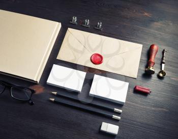 Photo of blank stationery set on wood table background. Corporate identity mockup. Responsive design template.
