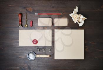 Vintage blank corporate stationery set on wooden background. Template for branding identity. Top view. Flat lay.