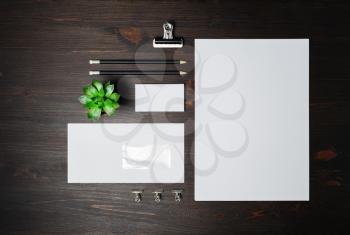Blank stationery set on wooden background. Corporate identity template. Responsive design mockup. Flat lay.
