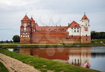 Mir, Belarus - August 04, 2017: Ancient medieval fortress on the shore of the lake. Architectural monument of the middle ages - Mir Castle.