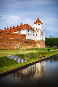 Mir, Belarus - August 04, 2017: Mir Castle is a museum and castle complex on the shore of the lake. UNESCO world heritage site. Vertical shot.