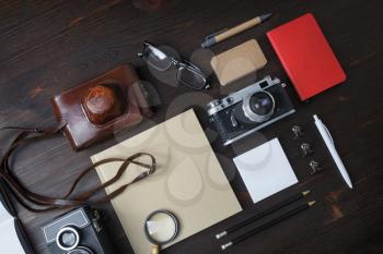 Travel concept with retro camera on wooden background. Flat lay.