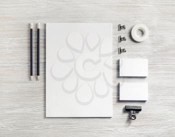 Blank white stationery set. Business brand template on light wooden background. Top view. Flat lay.