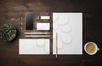 Photo of blank stationery set on wooden background. Corporate identity mock up for placing your design. Flat lay.