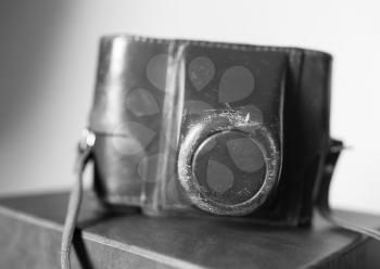 Black and white vintage camera case bokeh background