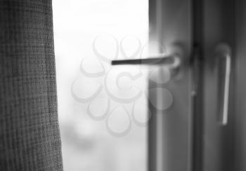 Black and white window curtain with light leak bokeh background

