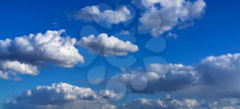 Horizontal vivid blue cloudscape background backdrop