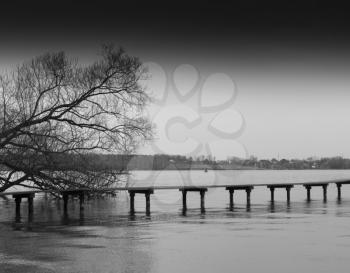 Horizontal bright black and white bridge on river background backdrop
