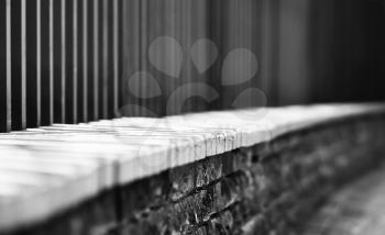 Horizontal black and white dramatic fence bokeh background
