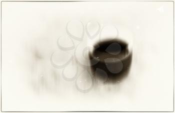 Horizontal vivid sepia coffee cup blur abstraction with dust particles background