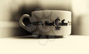 Horizontal vintage hot cup of coffee bokeh vignette background