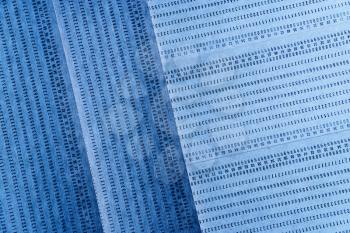 Diagonal vintage blue punched card textured background