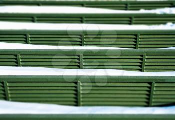 Green benches in snow background hd