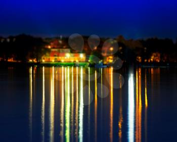 Dramatic reflections of river night illumination backdrop