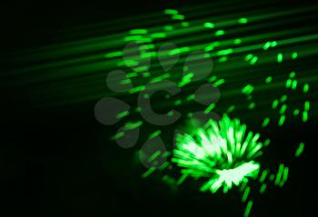 Dramatic green bokeh fireworks at night sky background