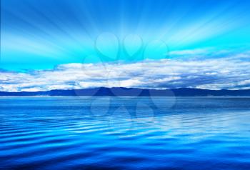 Ligth rays over the ocean hills landscape background hd