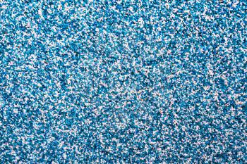 Horizontal vivid blue pebble grainy sand textured abstract background backdrop