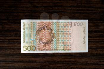500 Norwegian krones back on wood desk background hd
