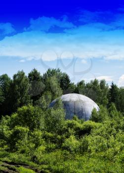 Vertical vivid extraterrestrial ufo sphere saucer in woods background backdrop