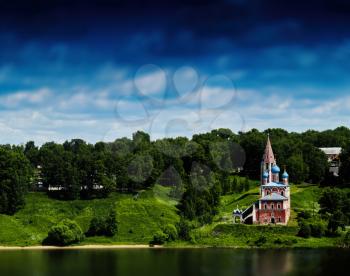 Horizontal vivid Russian landscape horizon river right aligned church bokeh background