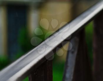 Horizontal balcony handrails under rain super detailed closeup abstraction bokeh background backdrop