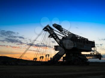 Horizontal vivid sunset industrial mining machine background backdrop