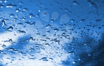 Cyan waterdrops after rain bokeh background