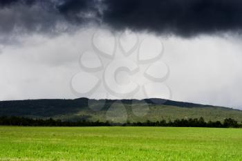 Horizontal Norway field under overcast clouds background hd