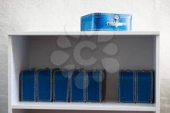 Blue toy cases on the shelf background hd