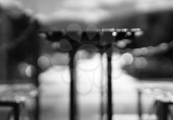 Black and white cafe table with benches bokeh background hd
