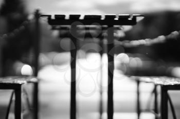 Black and white cafe table with benches bokeh background hd