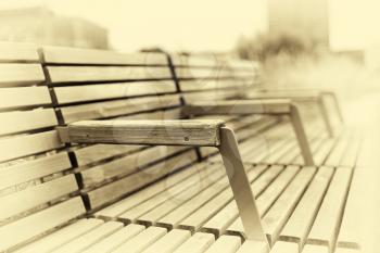 Straight Oslo city wooden bench in sepia background hd