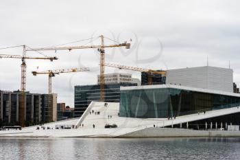 Industrial cranes near Oslo opera background hd