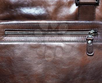 Horizontal brown leather case with zipper background