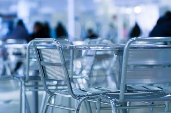 Horizontal empty cafe table with chairs bokeh background